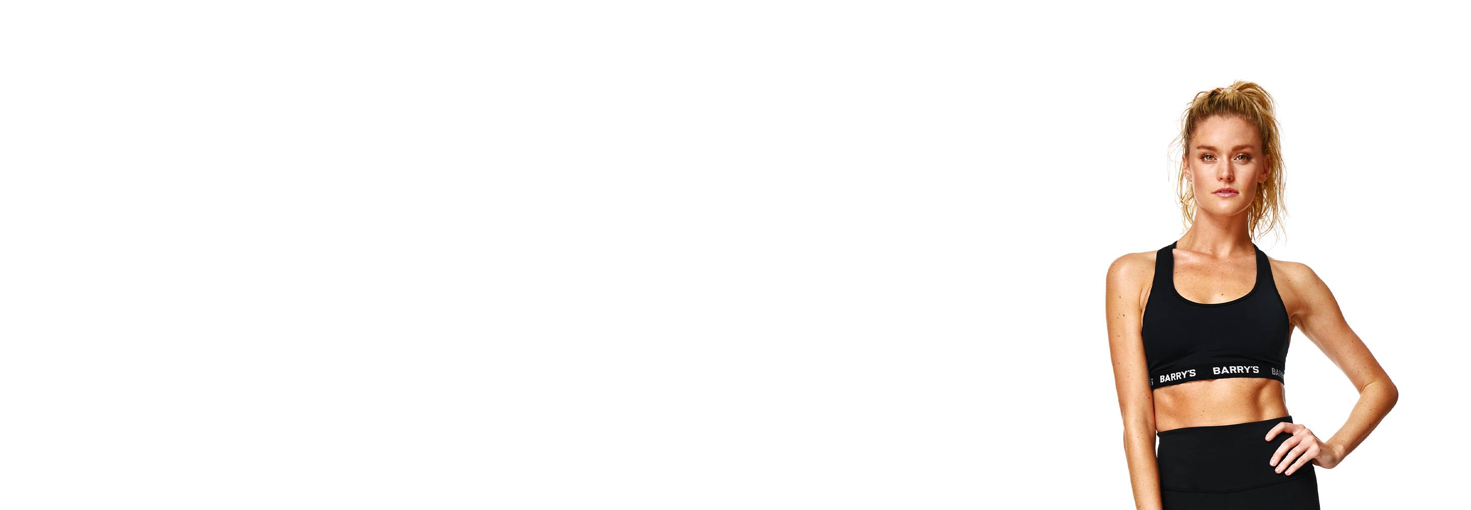 Barry's instructor standing confidently wearing a black top against a white background.