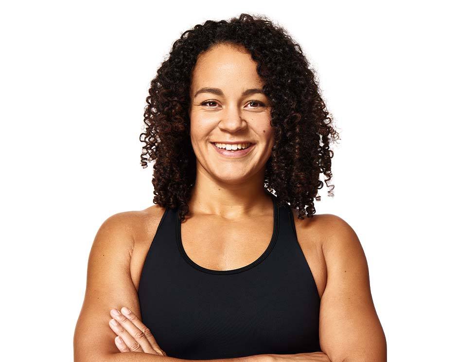 Barry's instructor standing confidently wearing a black top against a white background.