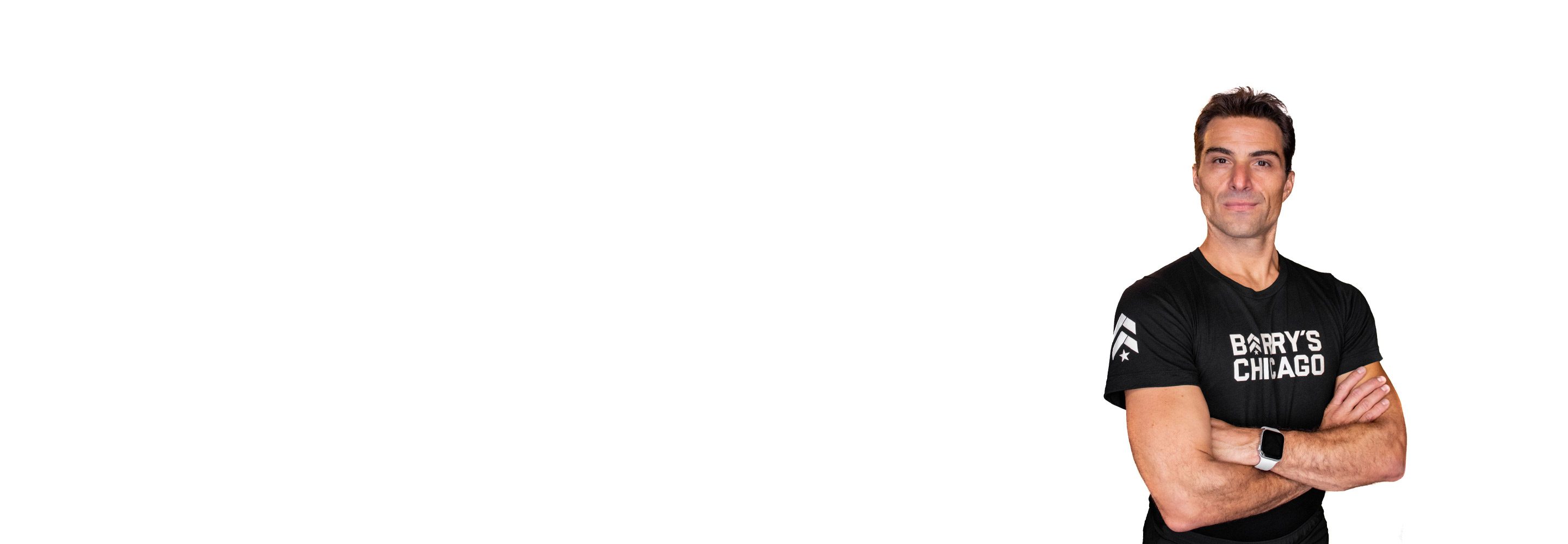 Barry's instructor standing confidently wearing a black top against a white background.