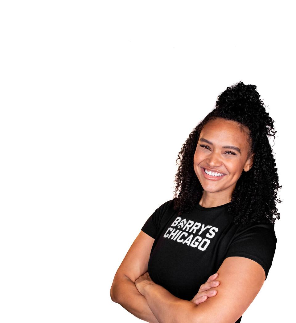 Barry's instructor standing confidently wearing a black top against a white background.