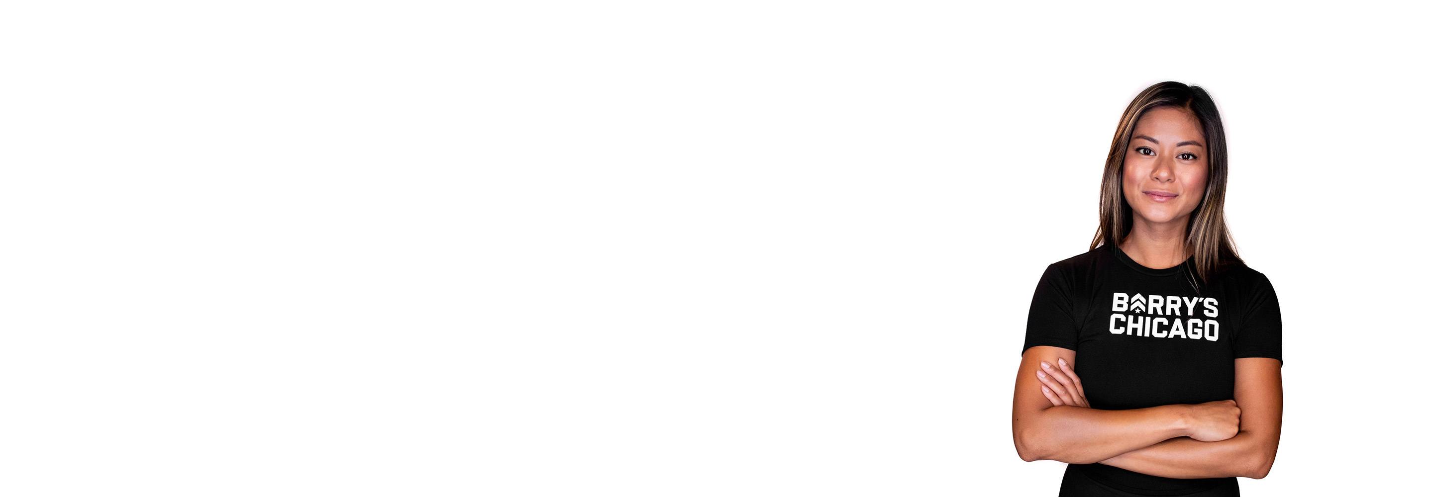 Barry's instructor standing confidently wearing a black top against a white background.