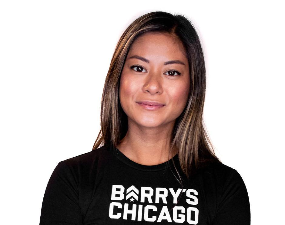 Barry's instructor standing confidently wearing a black top against a white background.