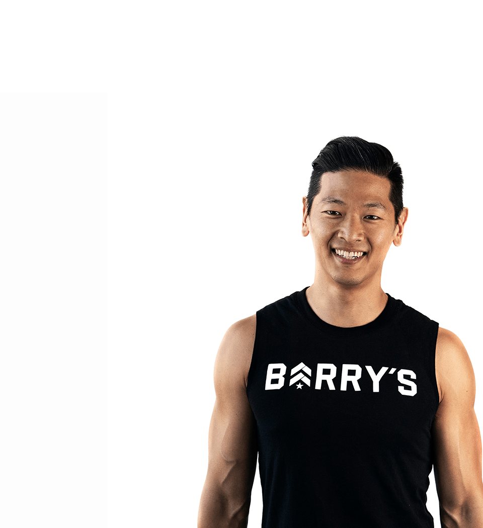 Barry's instructor standing confidently wearing a black top against a white background.