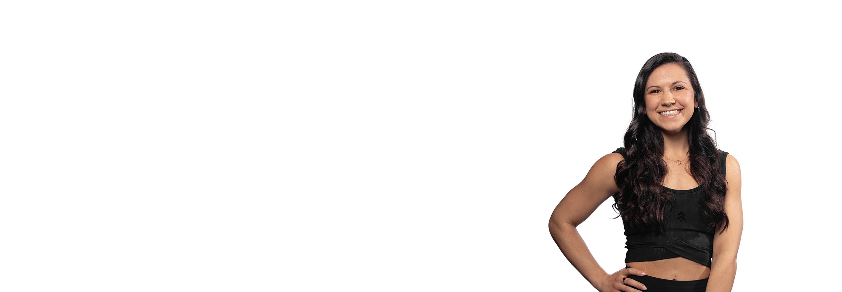 Barry's instructor standing confidently wearing a black top against a white background.