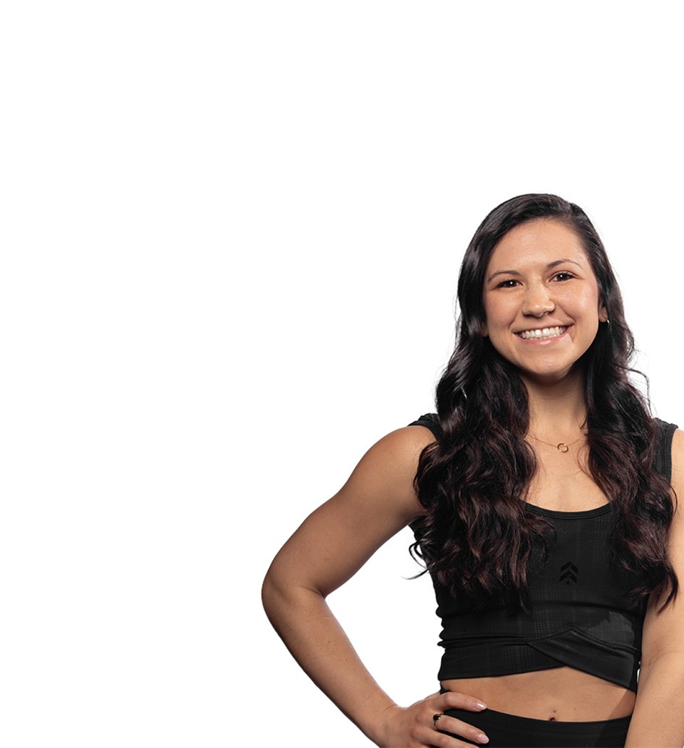 Barry's instructor standing confidently wearing a black top against a white background.