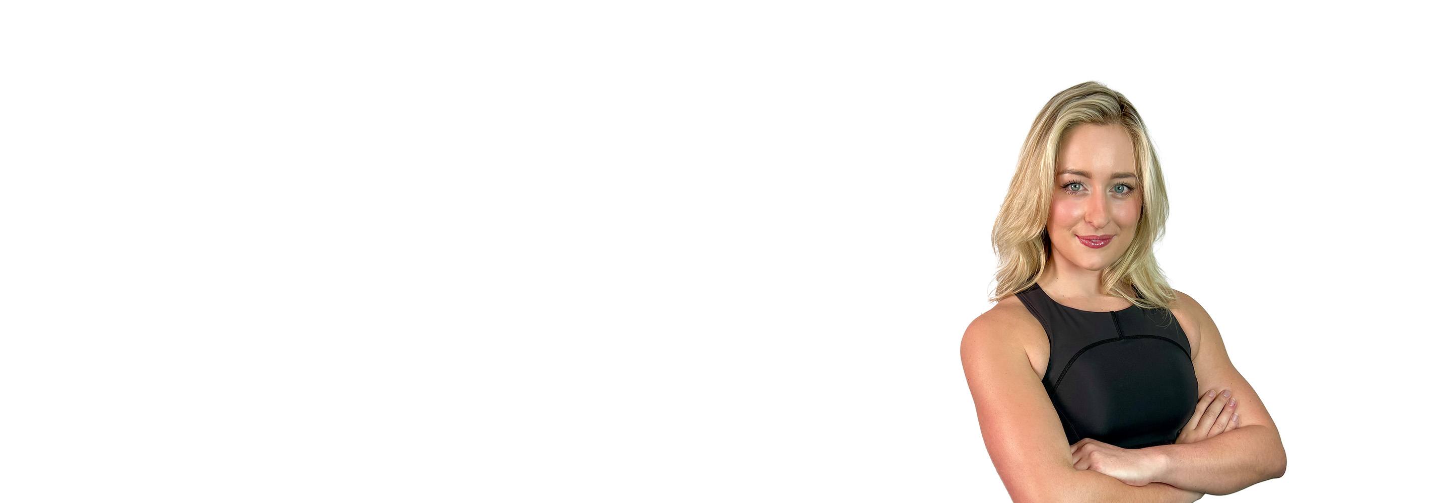 Barry's instructor standing confidently wearing a black top against a white background.