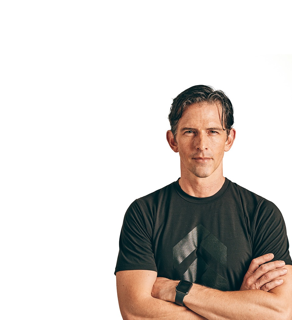 Barry's instructor standing confidently wearing a black top against a white background.