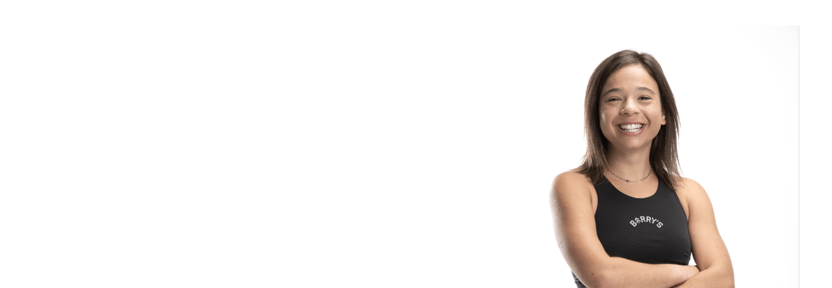 Barry's instructor standing confidently wearing a black top against a white background.