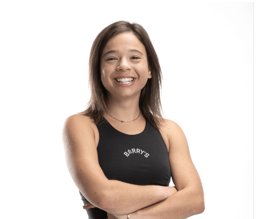 Barry's instructor standing confidently wearing a black top against a white background.