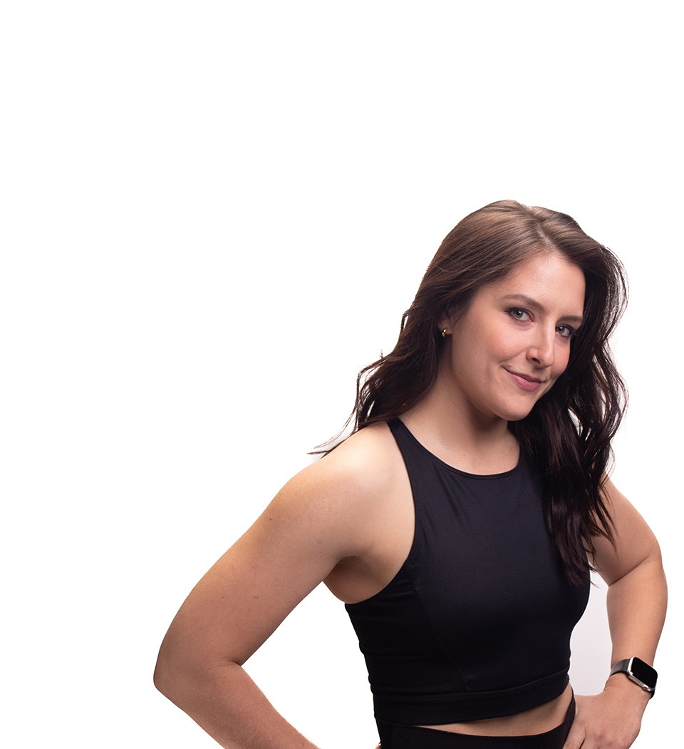 Barry's instructor standing confidently wearing a black top against a white background.