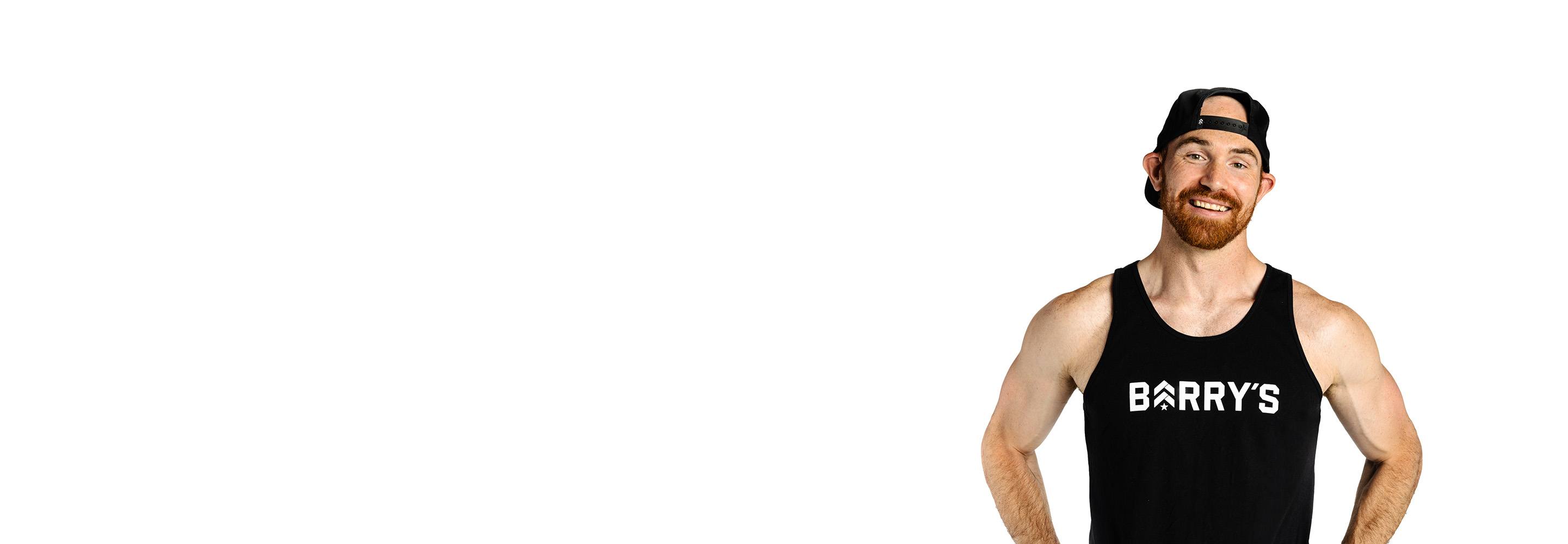 Barry's instructor standing confidently wearing a black top against a white background.