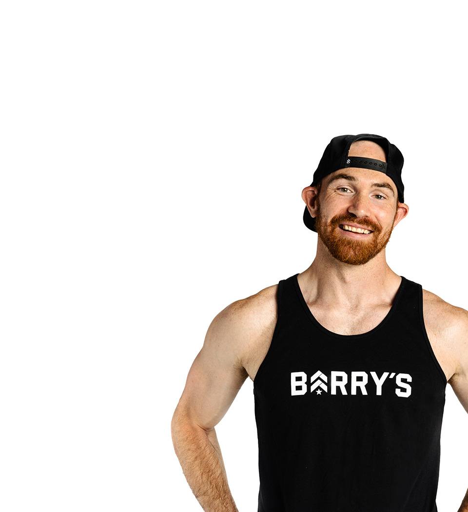 Barry's instructor standing confidently wearing a black top against a white background.