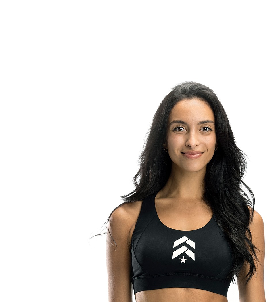 Barry's instructor standing confidently wearing a black top against a white background.