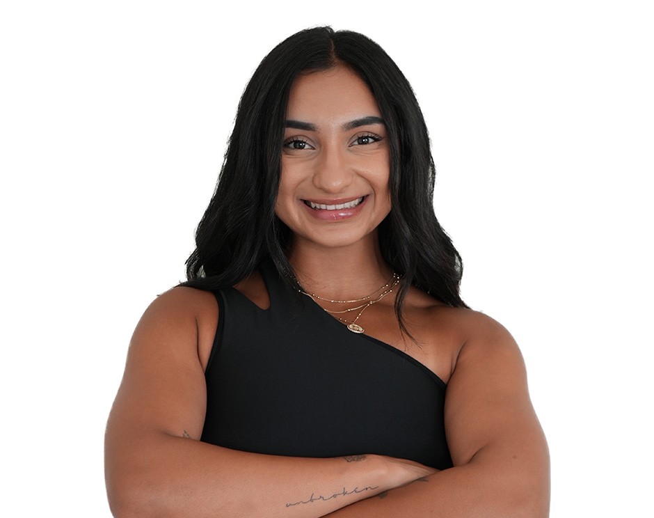 Barry's instructor standing confidently wearing a black top against a white background.
