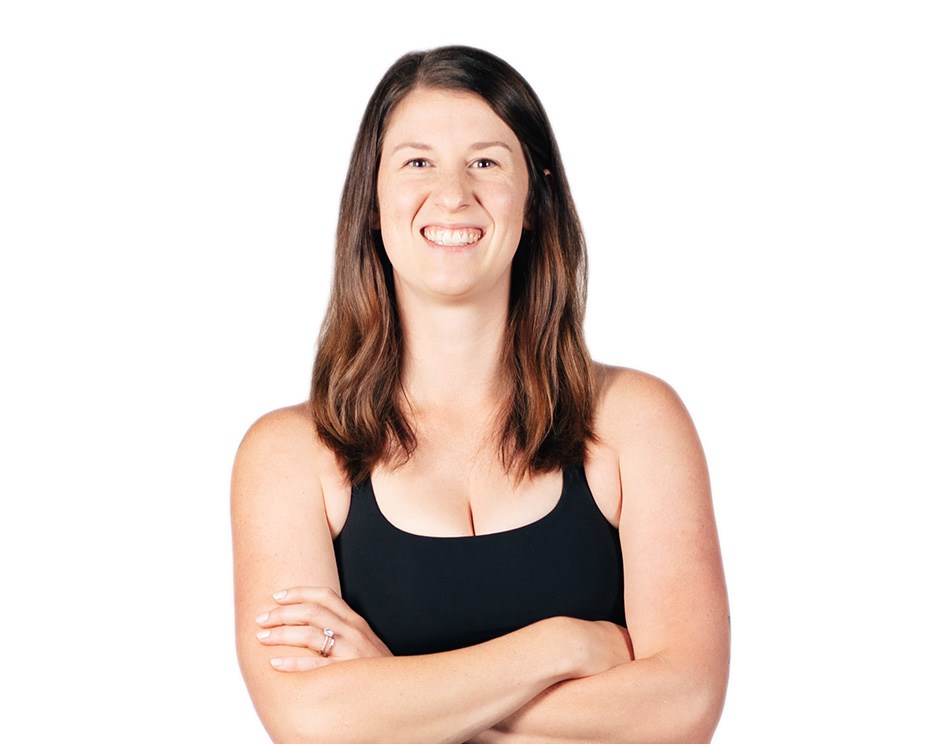 Barry's instructor standing confidently wearing a black top against a white background.