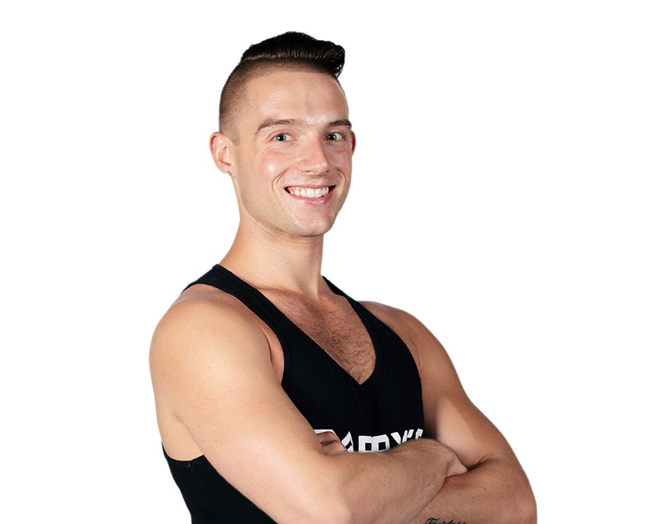 Barry's instructor standing confidently wearing a black top against a white background.