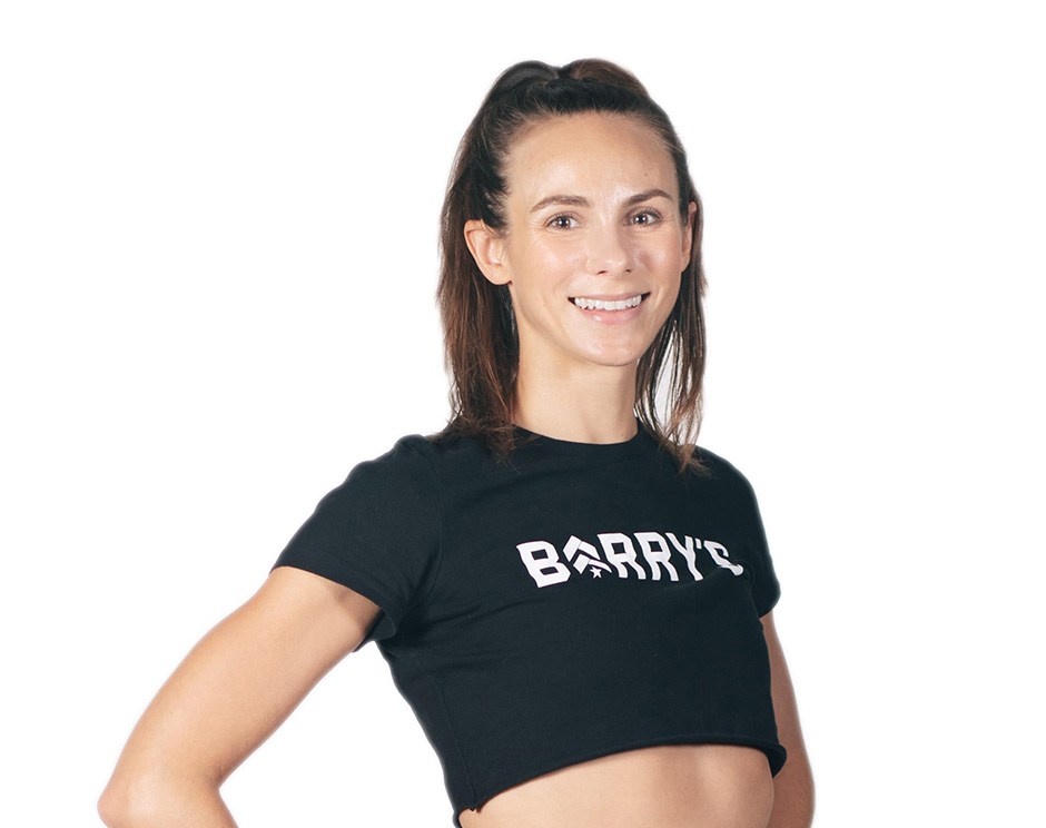 Barry's instructor standing confidently wearing a black top against a white background.