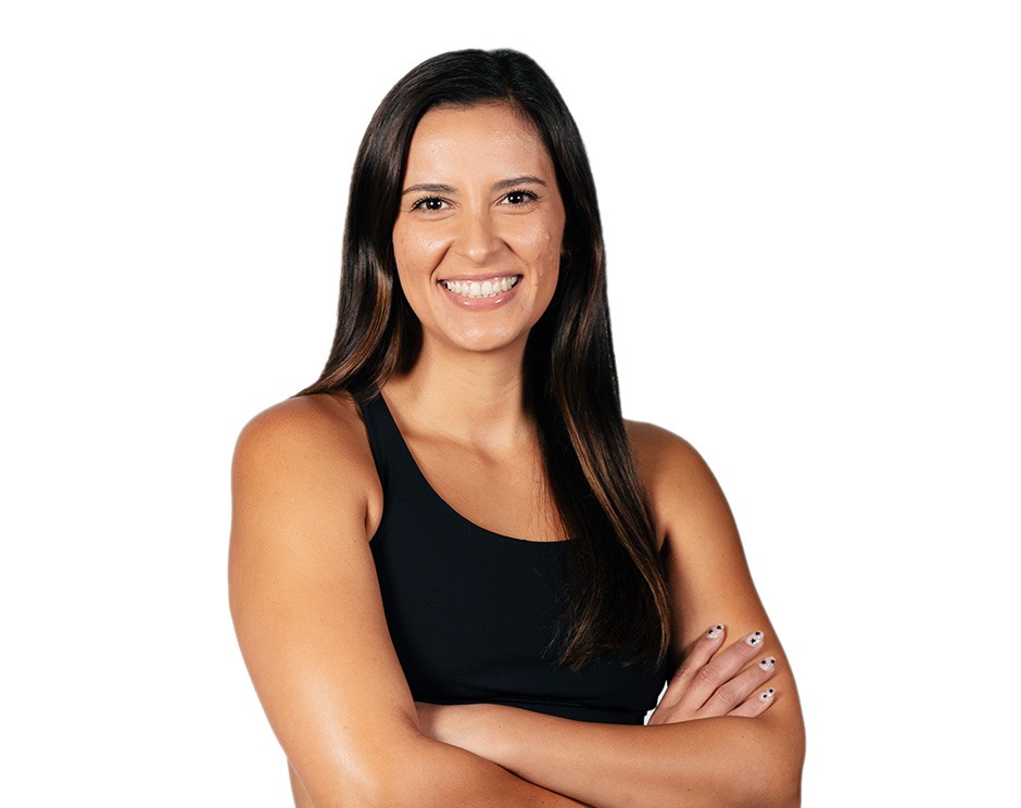 Barry's instructor standing confidently wearing a black top against a white background.