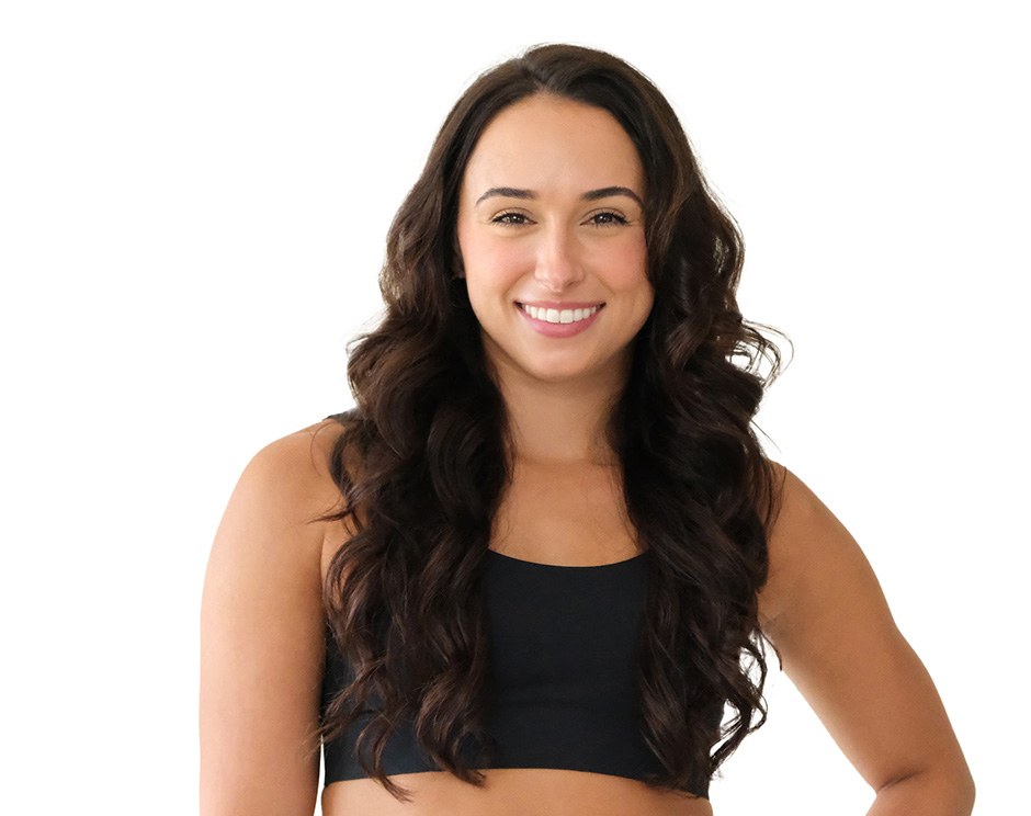 Barry's instructor standing confidently wearing a black top against a white background.