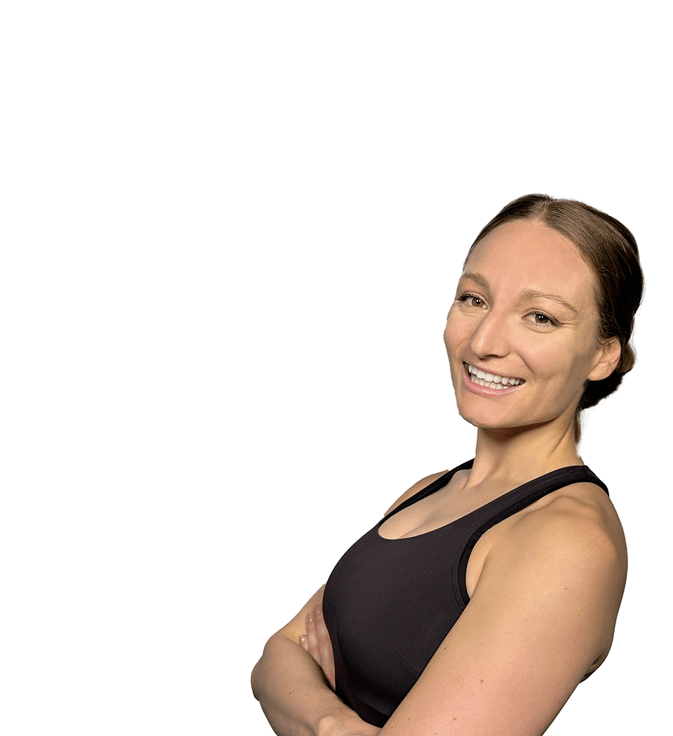 Barry's instructor standing confidently with arms crossed wearing a black top against a white background.