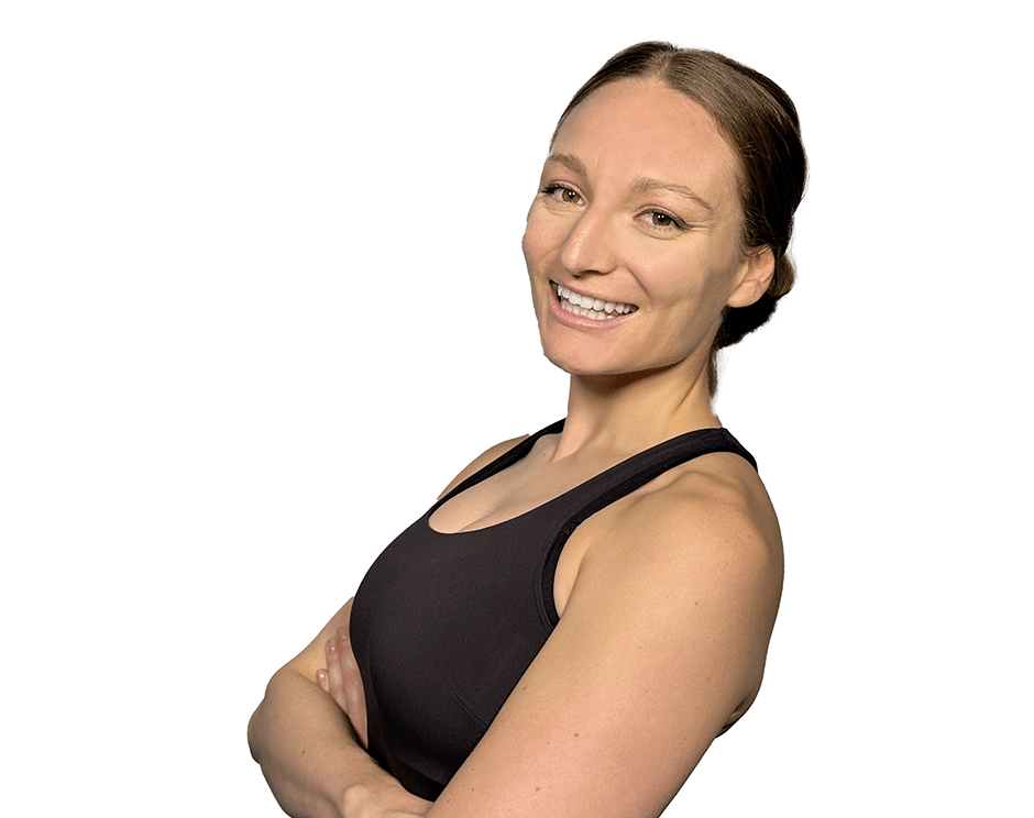 Barry's instructor standing confidently with arms crossed wearing a black top against a white background.