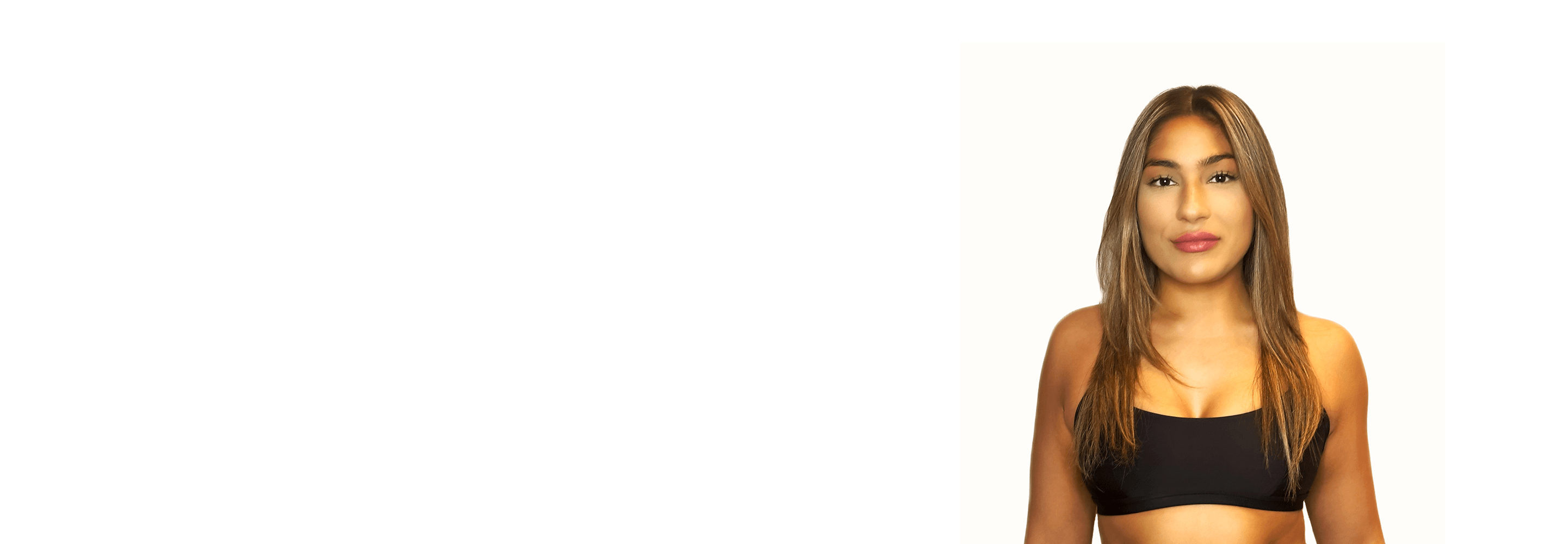 Barrys instruktör iklädd en svart topp står självsäkert och ler mot en vit bakgrund