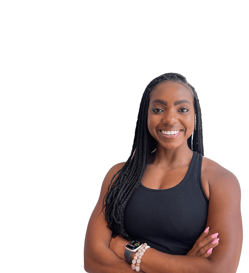 Barrys instruktör står självsäkert klädd i en svart topp mot en vit bakgrund.