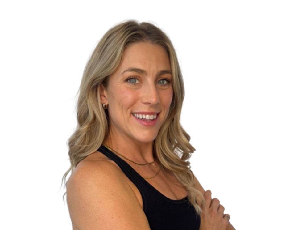 Barry's instructor standing confidently wearing a black top against a white background.