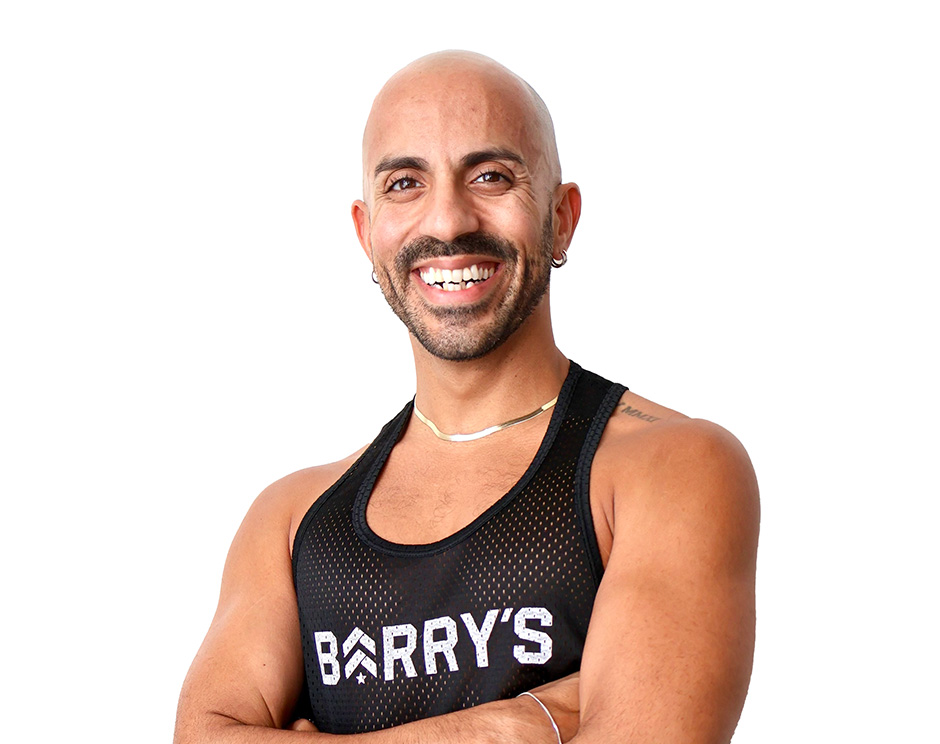Barry's instructor standing confidently wearing a black top against a white background.
