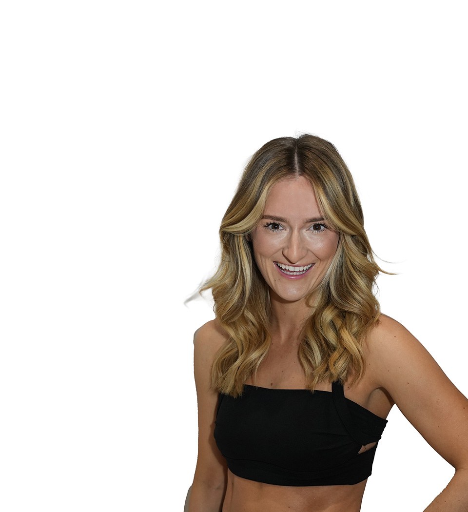 Barry's instructor standing confidently wearing a black top against a white background.