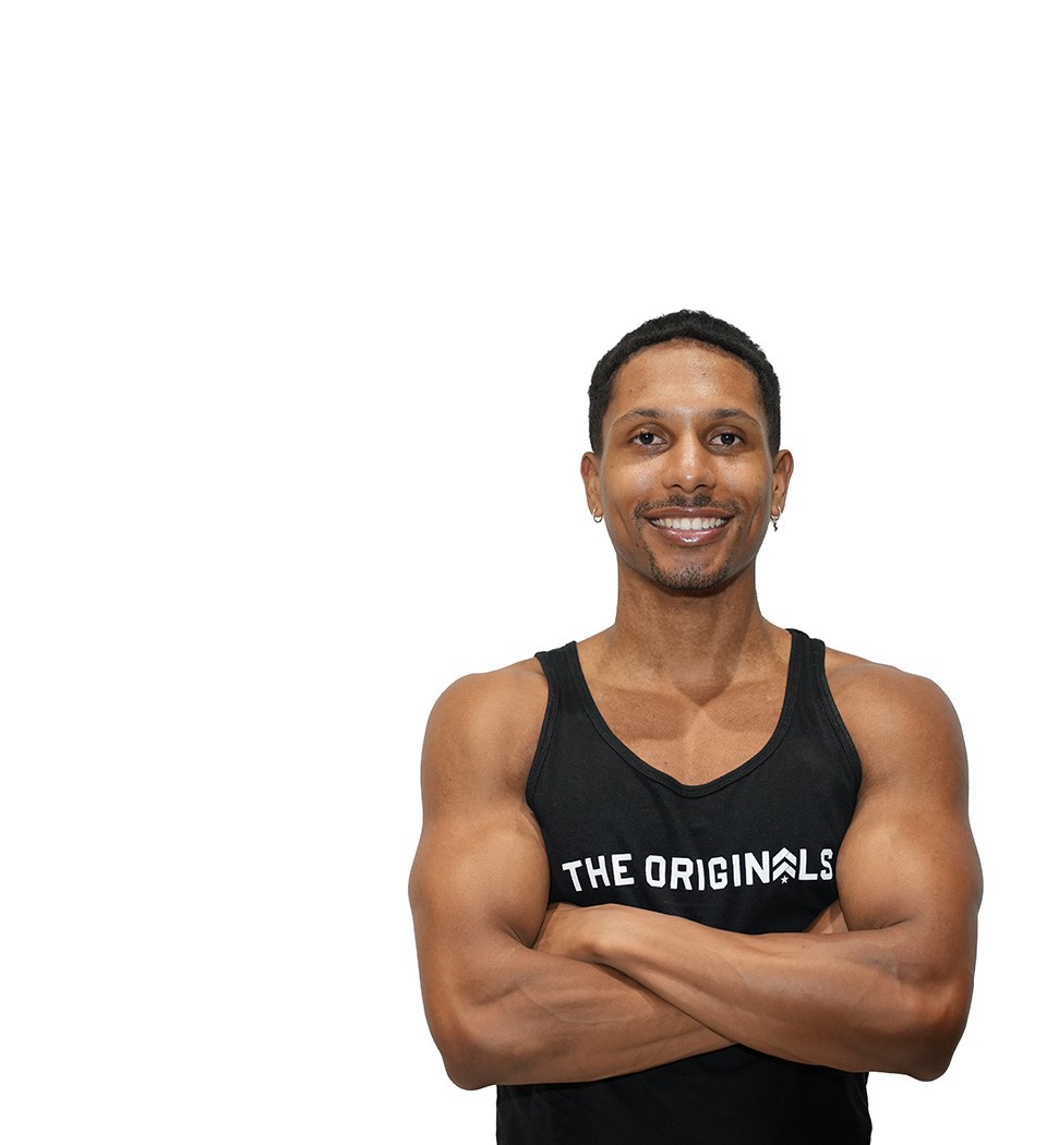 Barry's instructor standing confidently wearing a black top against a white background.