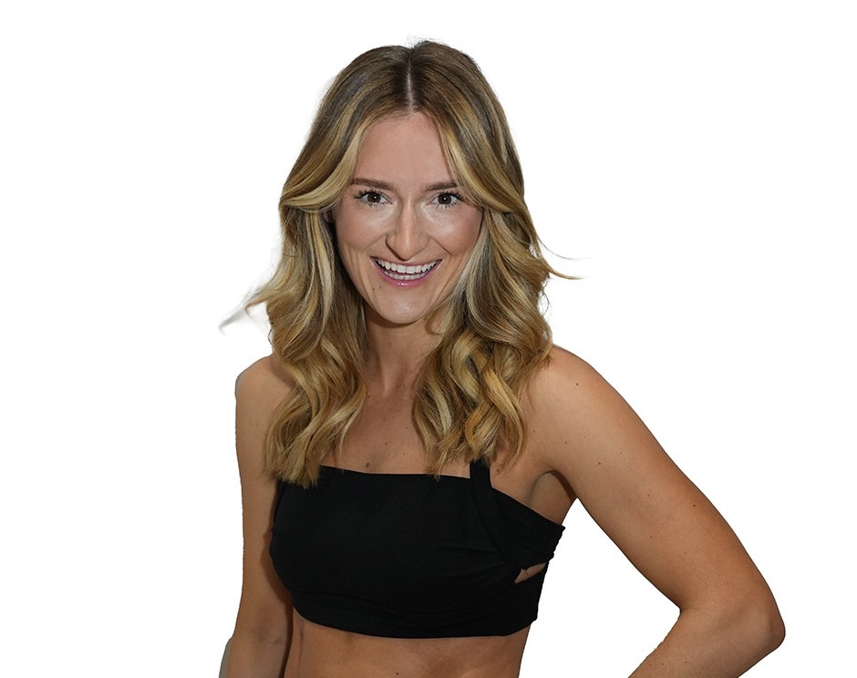 Barry's instructor standing confidently wearing a black top against a white background.