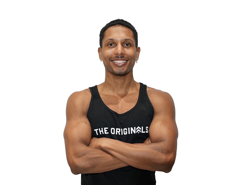 Barry's instructor standing confidently wearing a black top against a white background.