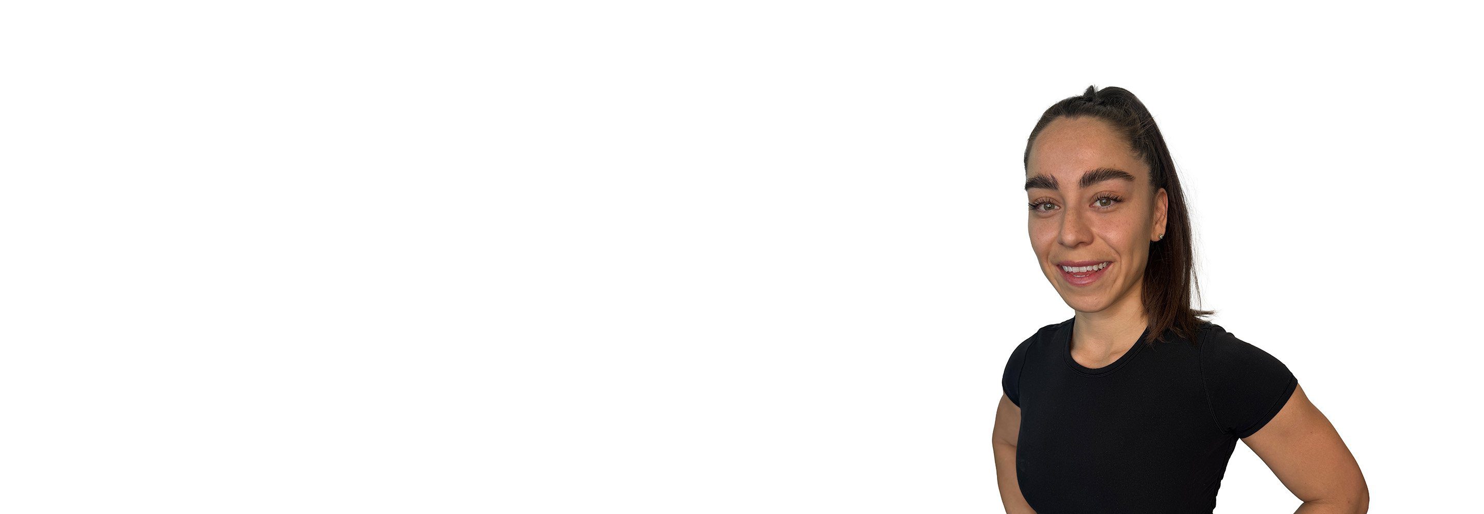 Barry's instructor standing confidently wearing a black top against a white background.