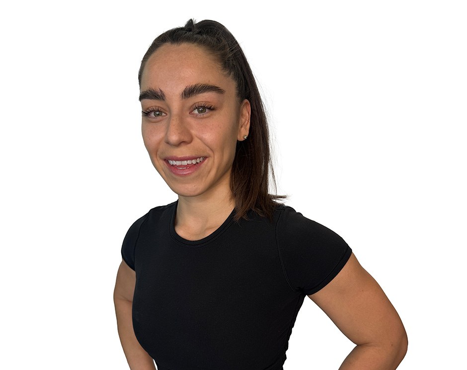 Barry's instructor standing confidently wearing a black top against a white background.