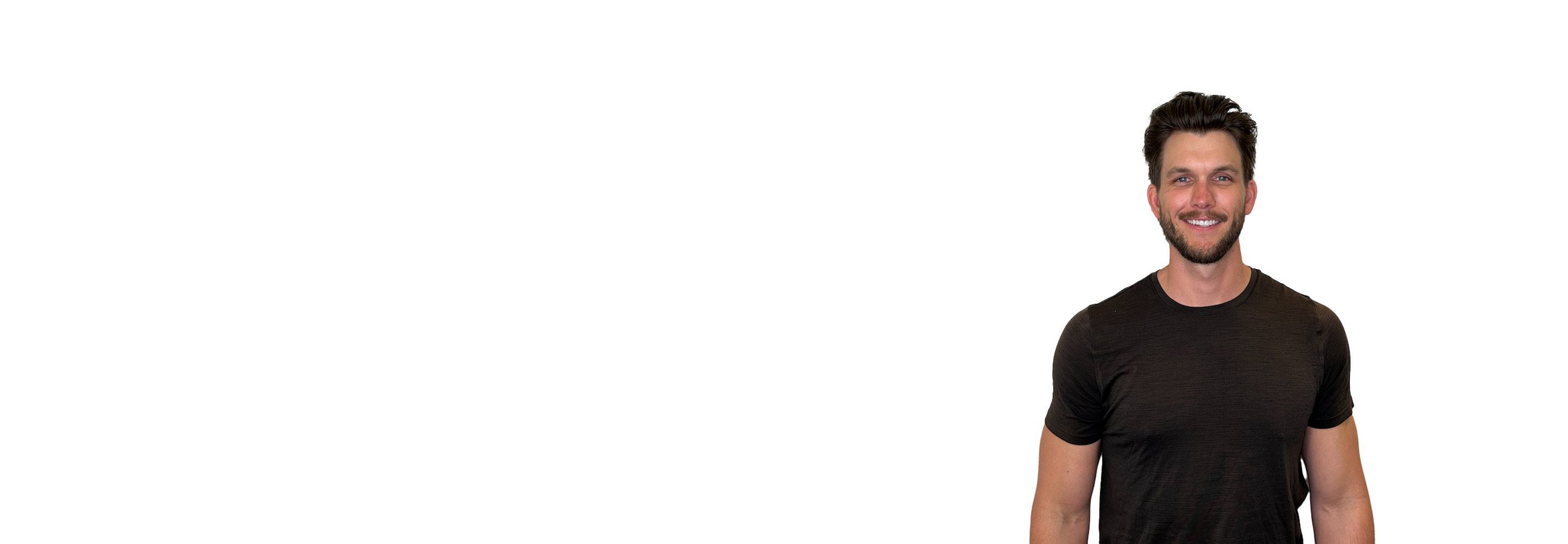 Barry's instructor standing confidently wearing a black top against a white background.