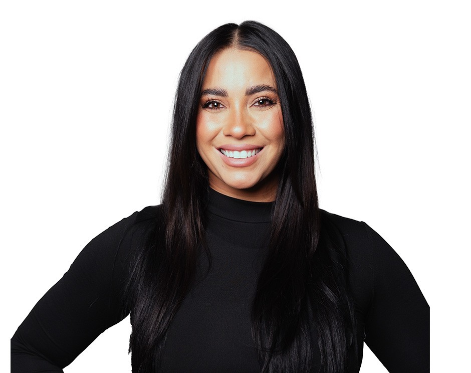 Barry's instructor standing confidently wearing a black top against a white background.
