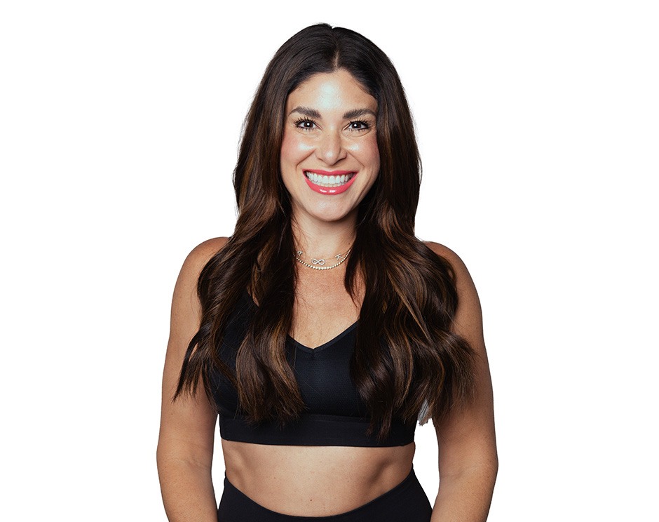 Barry's instructor standing confidently wearing a black top against a white background.