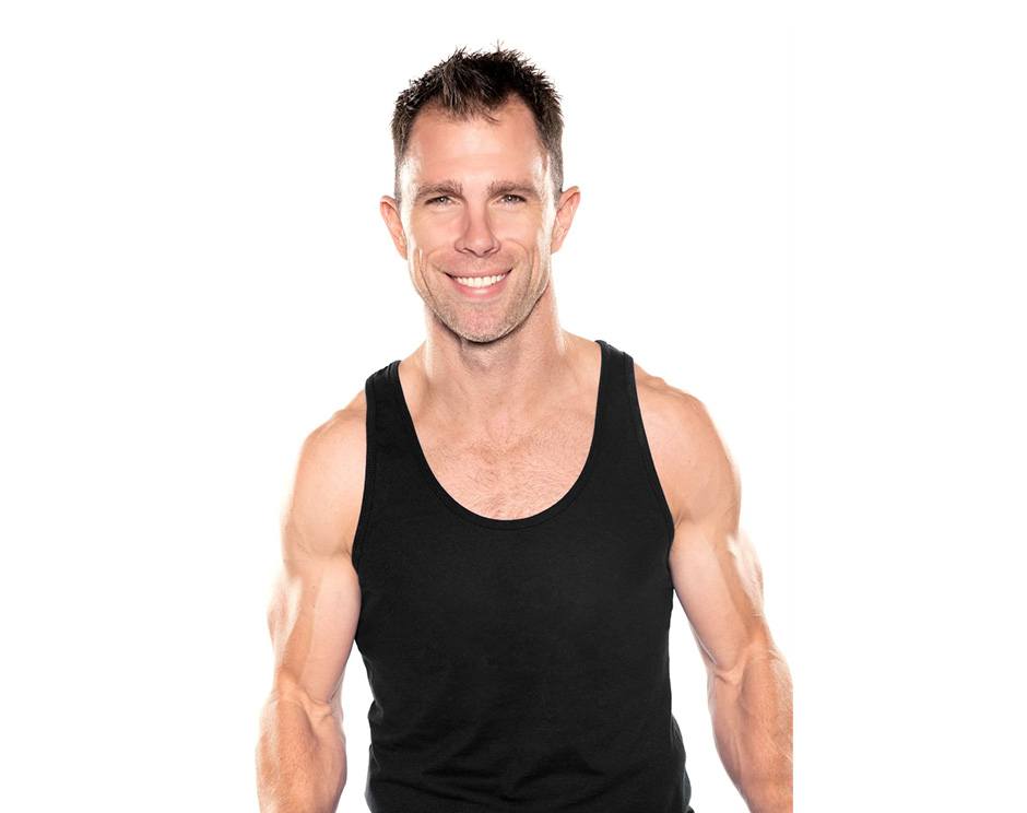 Barry's instructor standing confidently wearing a black top against a white background.
