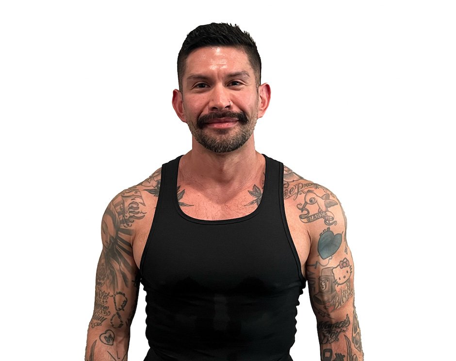 Barry's instructor standing confidently wearing a black top against a white background.