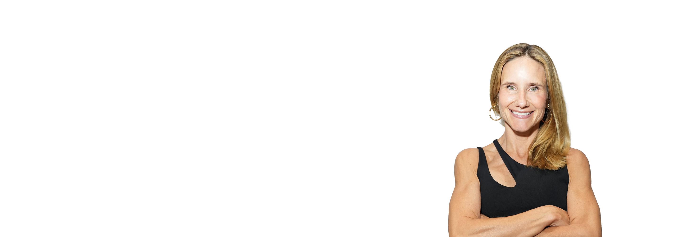 Barry's instructor standing confidently wearing a black top against a white background.