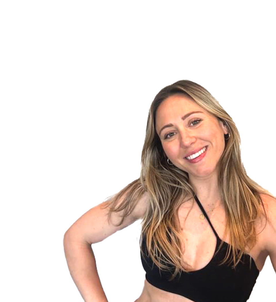 Barry's instructor standing confidently, wearing a black tank top against a white background, ready for the next workout challenge.