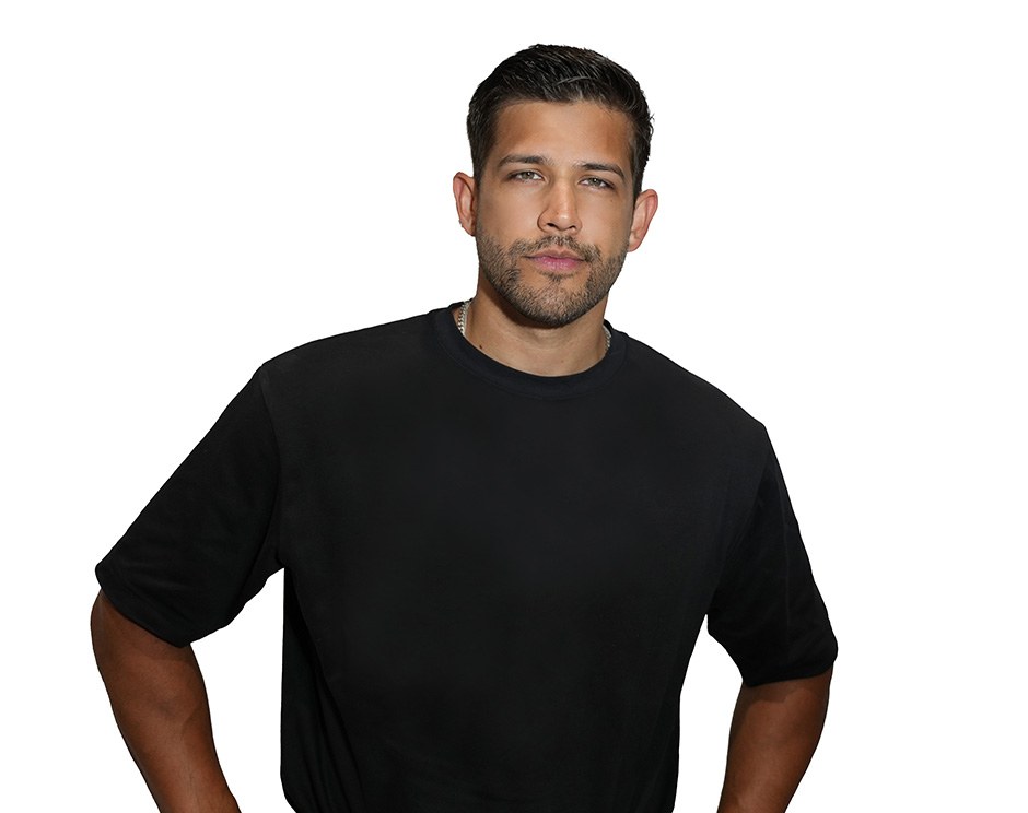 Barry's instructor standing confidently wearing a black top against a white background.