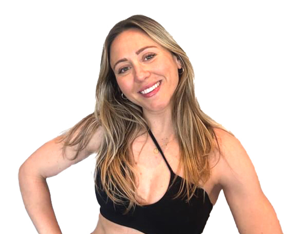 Barry's instructor standing confidently, wearing a black tank top against a white background, ready for the next workout challenge.