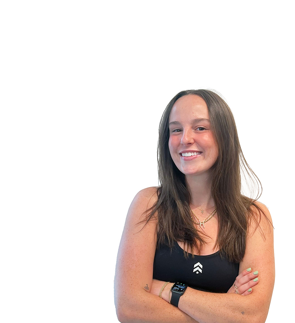 Barry's instructor standing confidently wearing a black top against a white background.