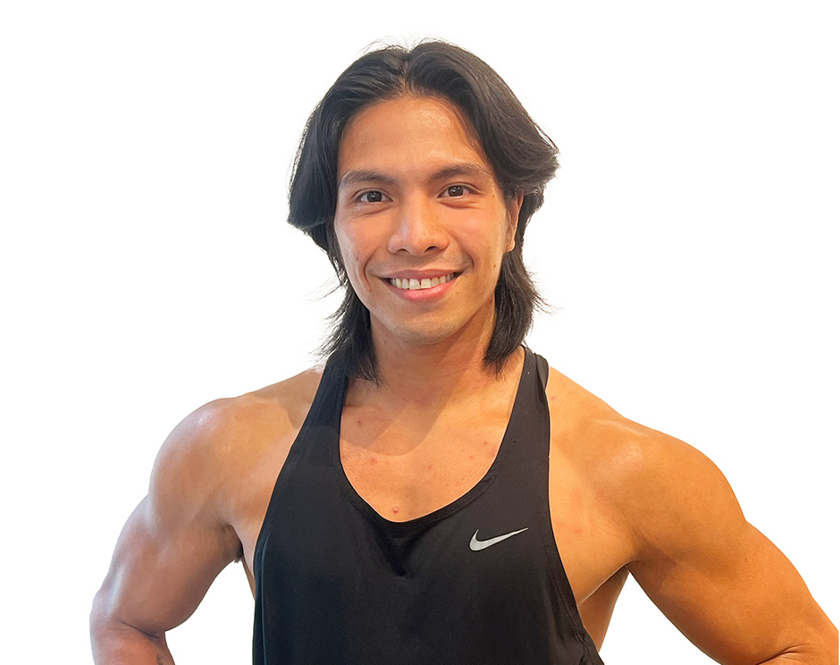 Barry's instructor standing confidently wearing a black top against a white background.