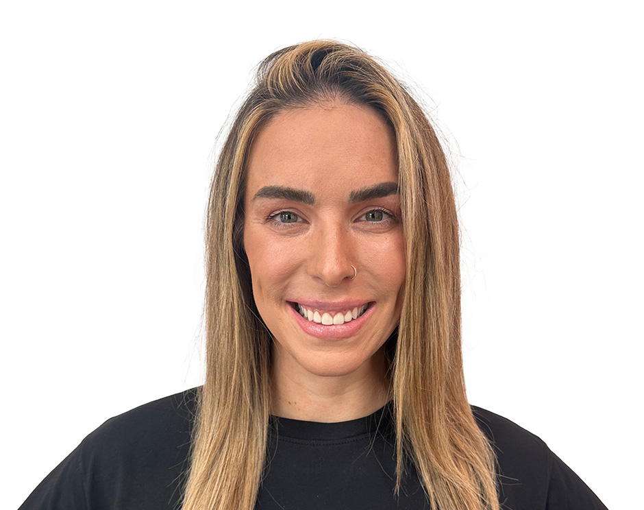 Barry's instructor standing confidently wearing a black top against a white background.