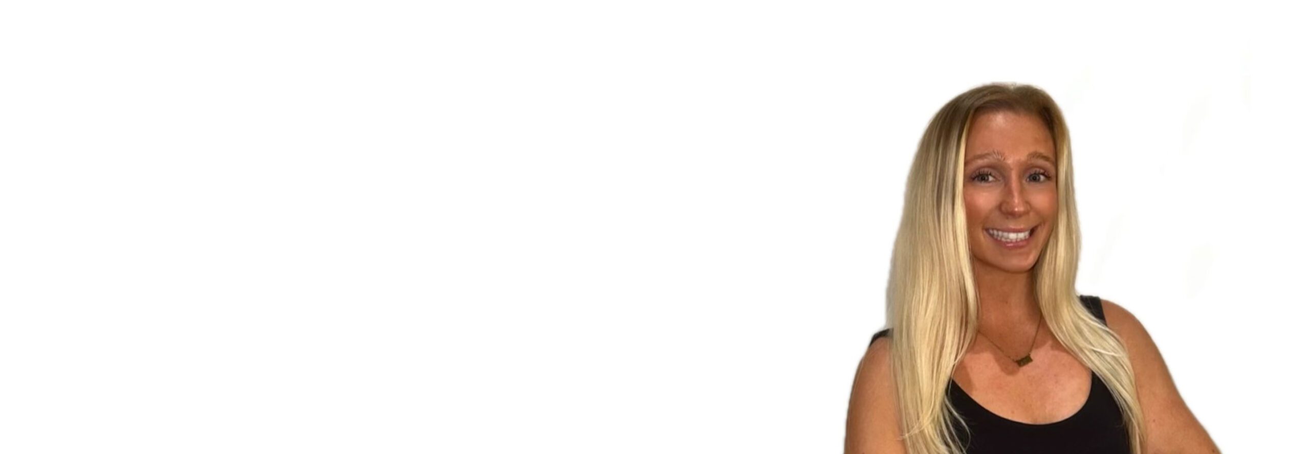 Ashling D. Barry's instructor standing confidently wearing a black top against a white background.