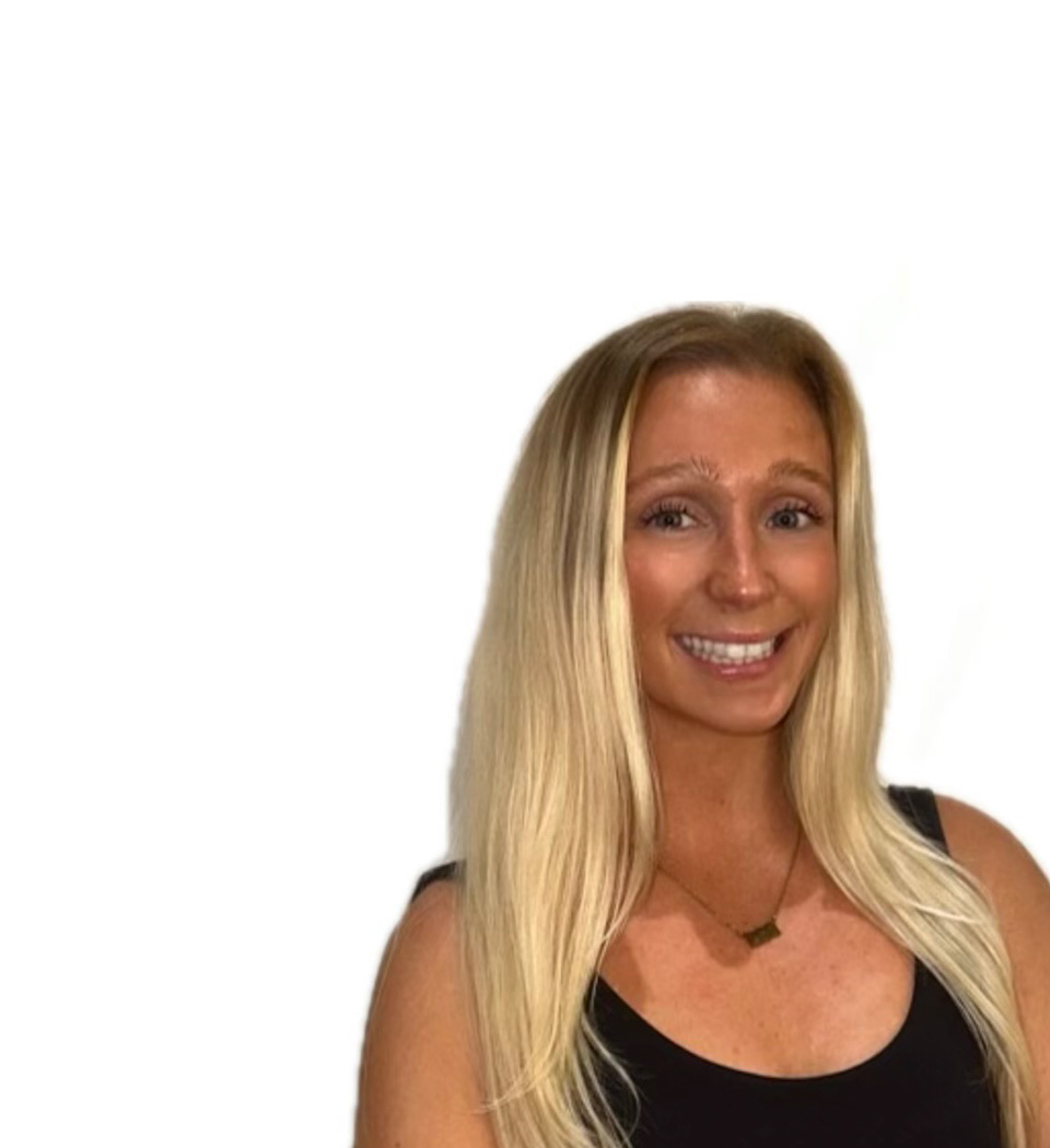 Barry's instructor standing confidently wearing a black top against a white background.