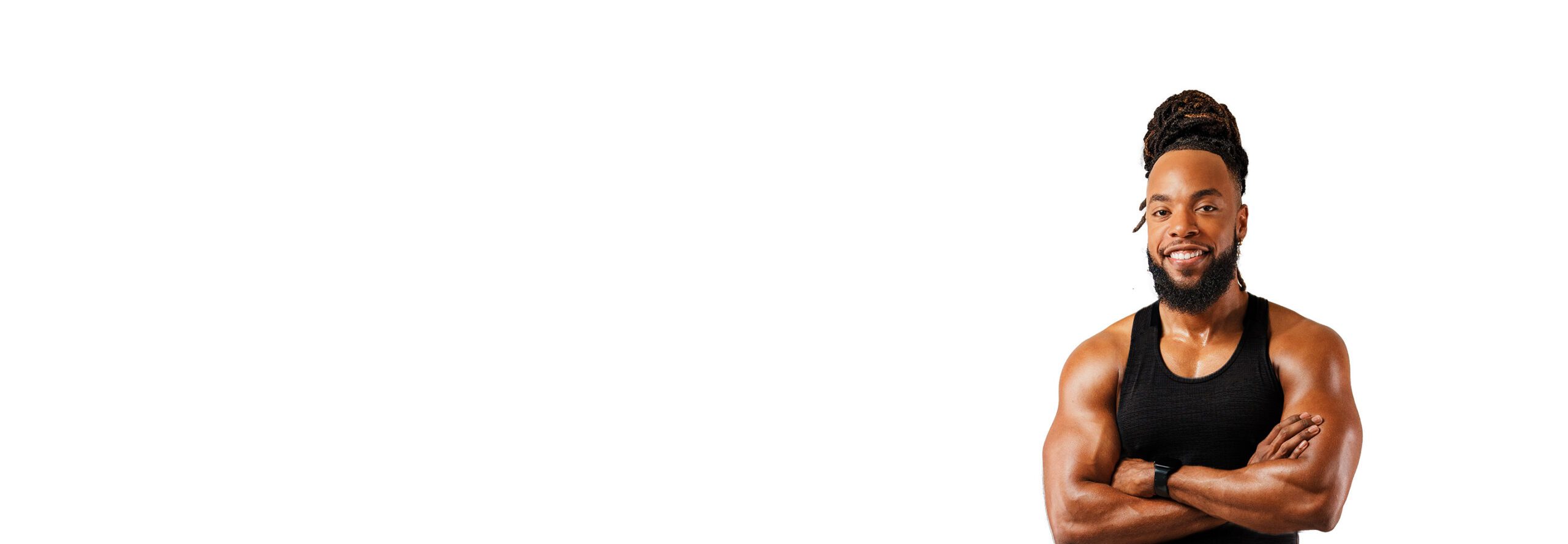 Barrys instruktör står självsäkert klädd i en svart topp mot en vit bakgrund.